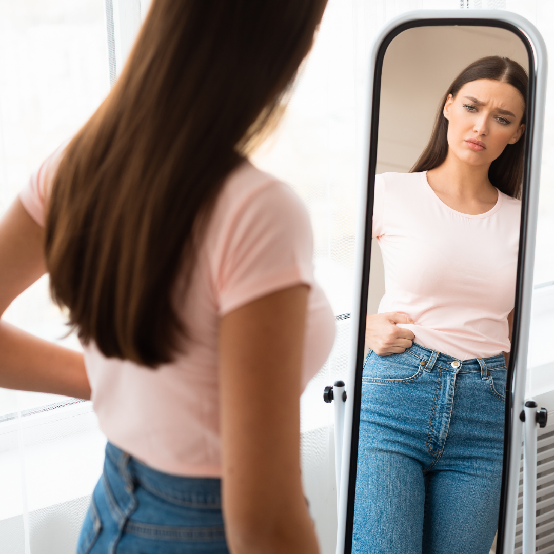 A lady looking in the mirror