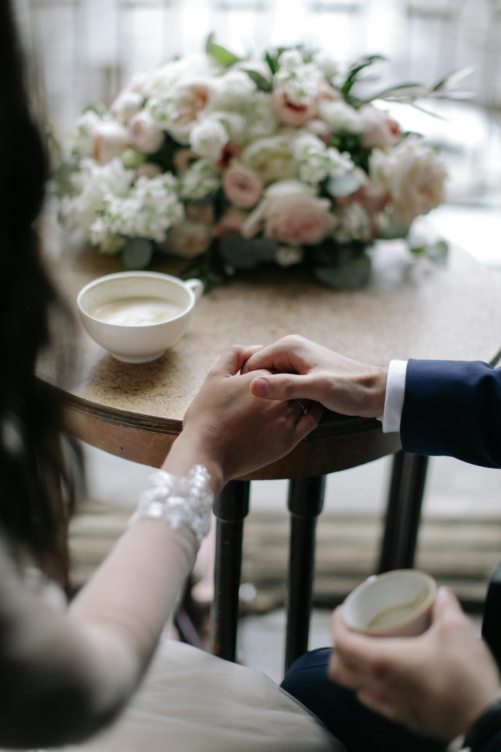 Bride And Groom Holding Each Others Hand